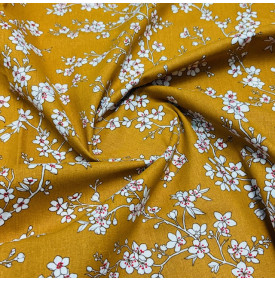Coton imprimé Osaka jaune, motif floral délicat et lumineux.
