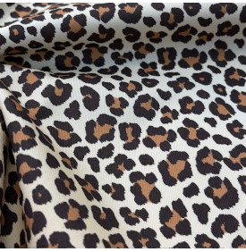 Tissu sergé de coton imprimé motif léopard sur fond écru