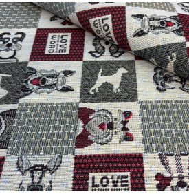 Tissu jacquard décoratif à motif chiens et patchwork graphique, touches rouges et esprit chaleureux.