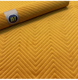 Velours matelassé motif chevron jaune soleil   relief élégant et toucher doux pour déco et maroquinerie.